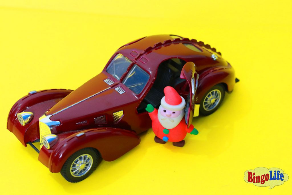 Santa Claus with brown car
