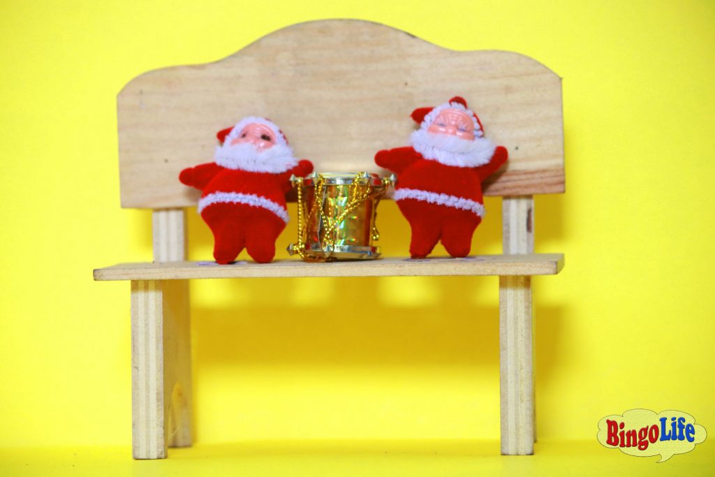 two Santas on chair